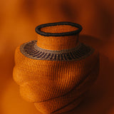Orchard Abstraction: Large orange and black hand-woven African basket
