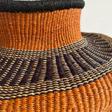 Orchard Abstraction: Large orange and black hand-woven African basket